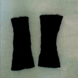Black knitted fingerless gloves